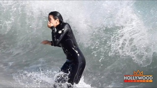 Dua Lipa Gets PUMMELED By A Wave!